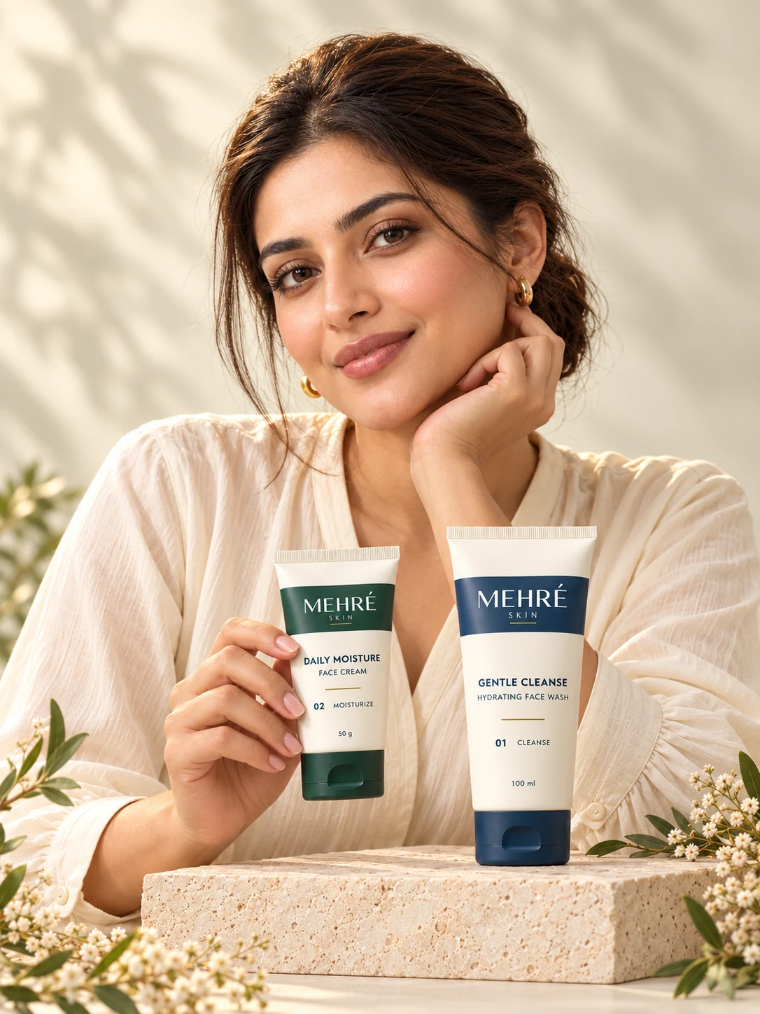 Model presenting both MEHRÉ SKIN essentials: Gentle Cleanse face wash and Daily Moisture cream